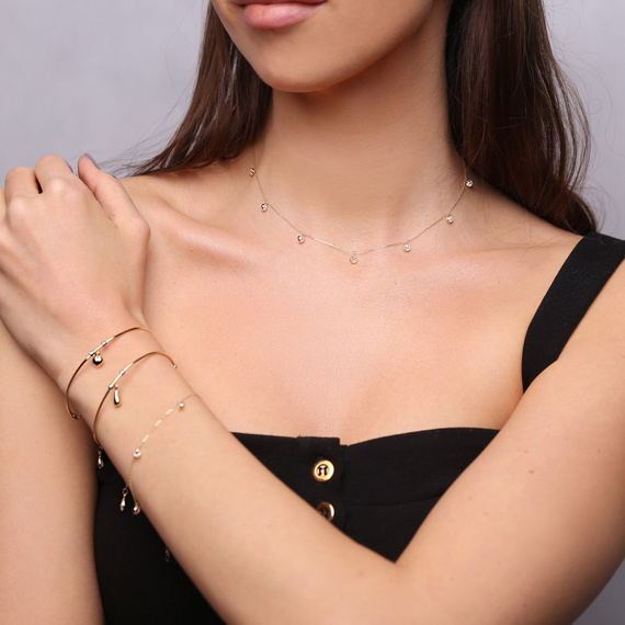 Steifes Goldarmband mit Perlen und Tränen 585