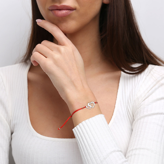 585 Goldarmband auf roter Kordel Herzperlen