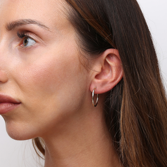 Goldene Ohrringe 585 Kreolen 23 mm mit spiralförmiger Drehung